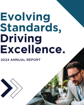 2024 Annual Report Cover Photo with two professionals looking at a laptop